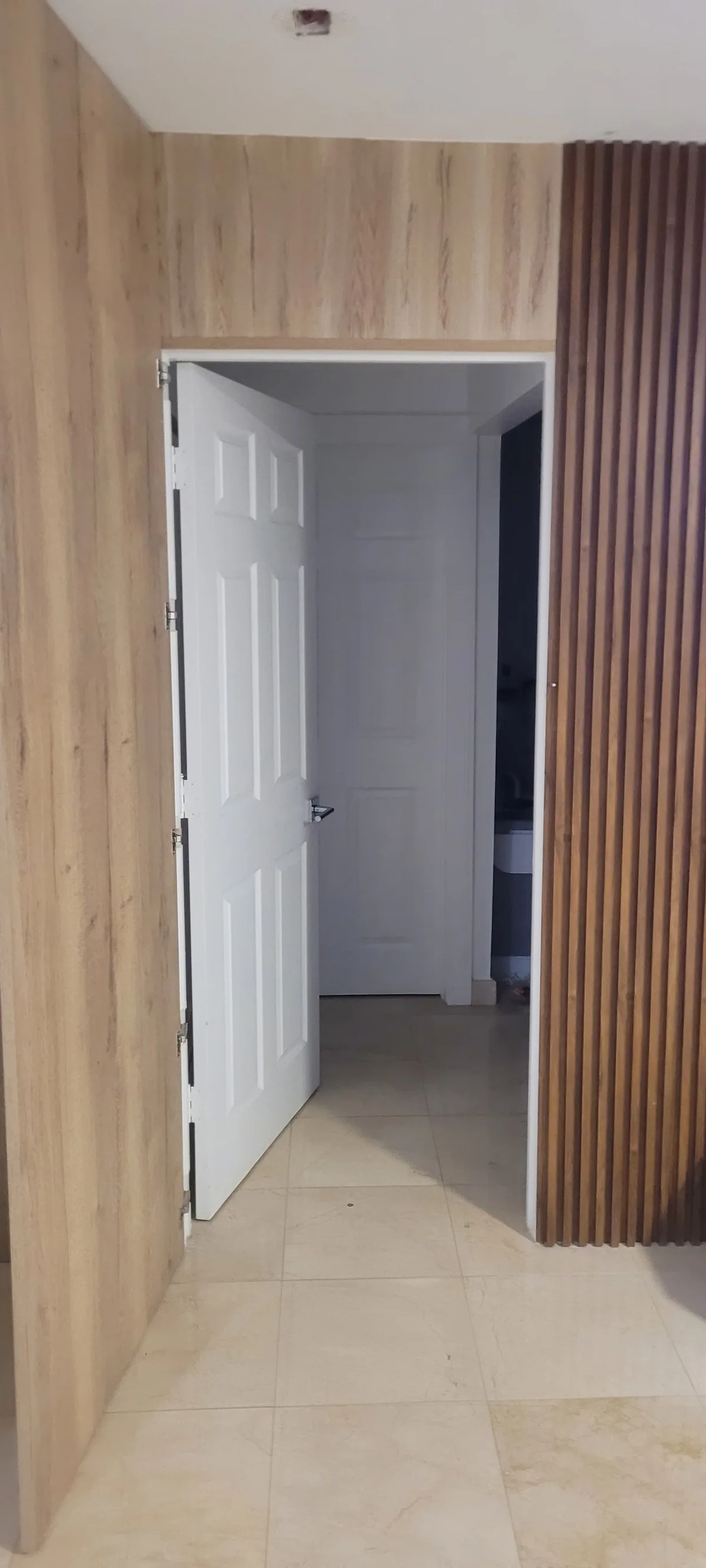 Wood slat accent wall beside an interior doorway